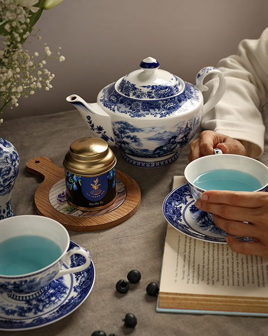 Pekoe Masala Tea in a container and a tea bag in a glass cup