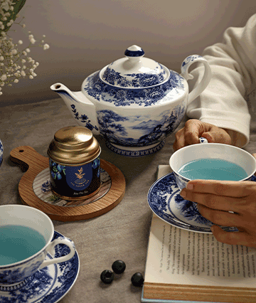 Pekoe tea's blue tea in a cup and container