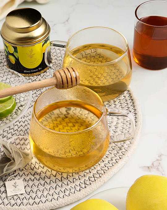 Pekoe Honey lemon tea in a container and serving cups