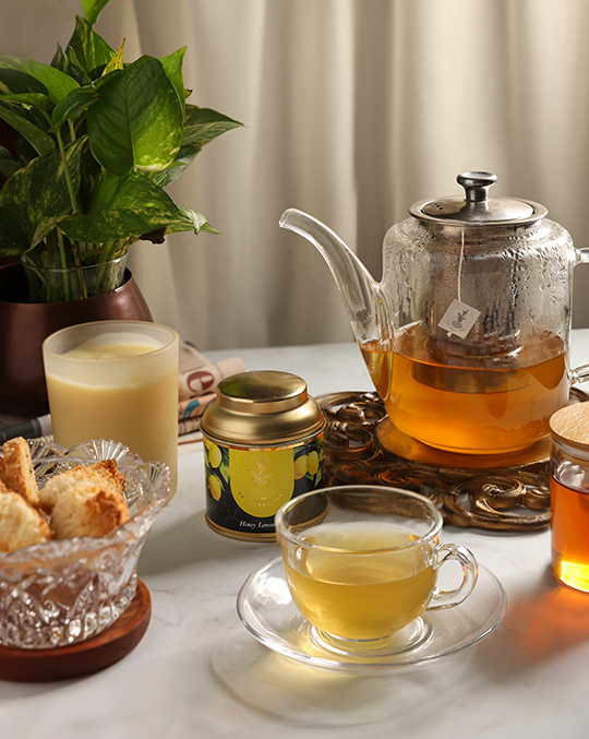 Pekoe Honey lemon tea in a container and a serving pot and a cup